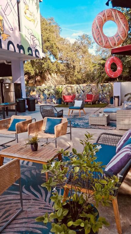 Backyard with lounge seating and shaded chairs at Atrium